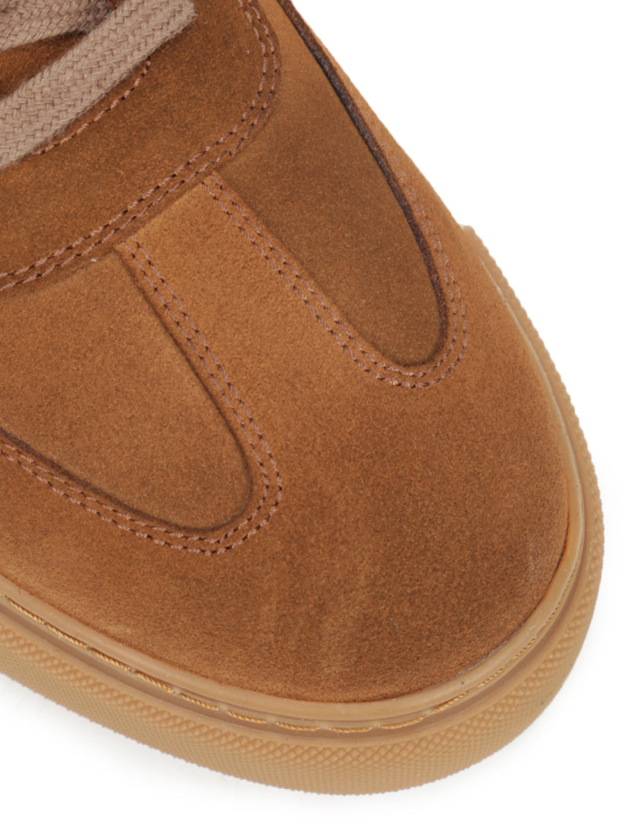Suede sneakers decorated with leather inserts