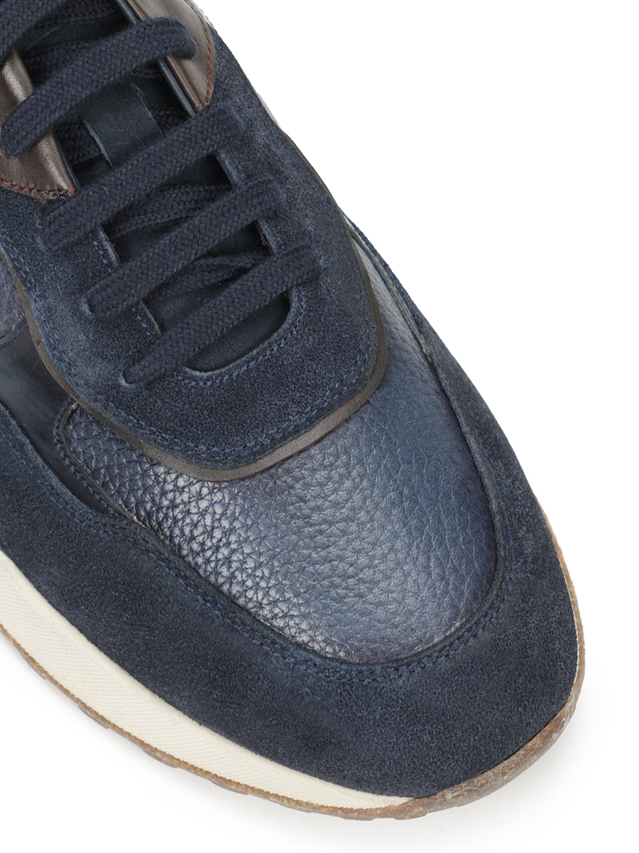 Suede sneakers decorated with suede inserts